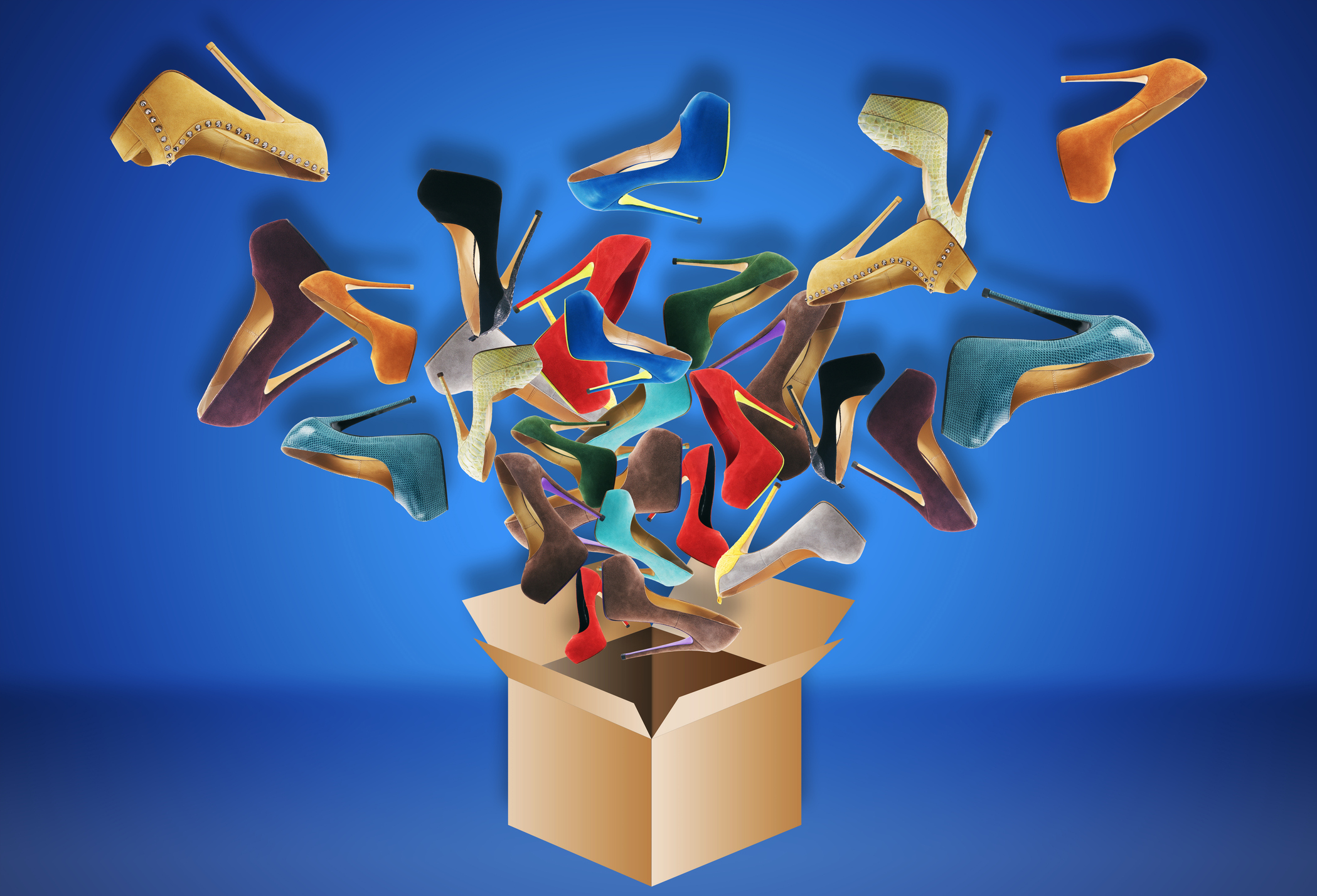 an open cardboard box with colorful high-heeled shoes flying out of it