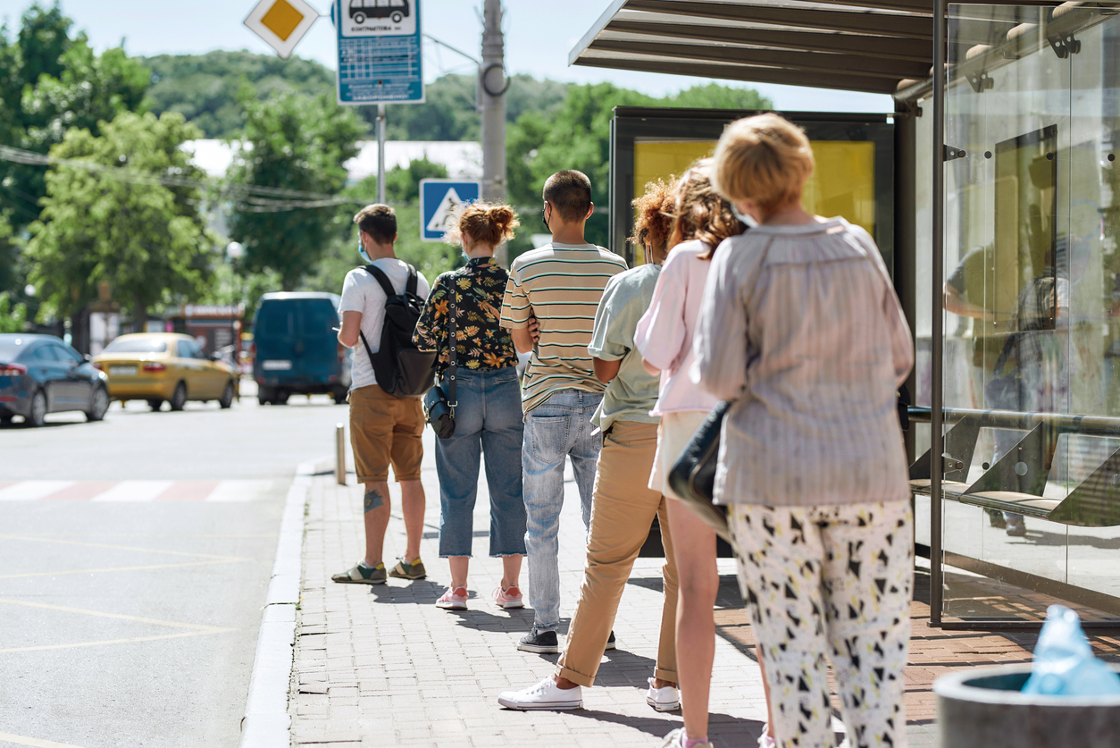 people in line at a bus stop
